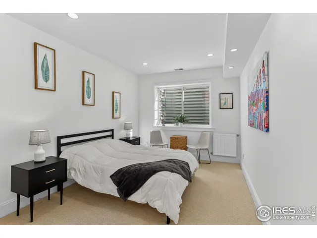 a bedroom with a bed and a couch