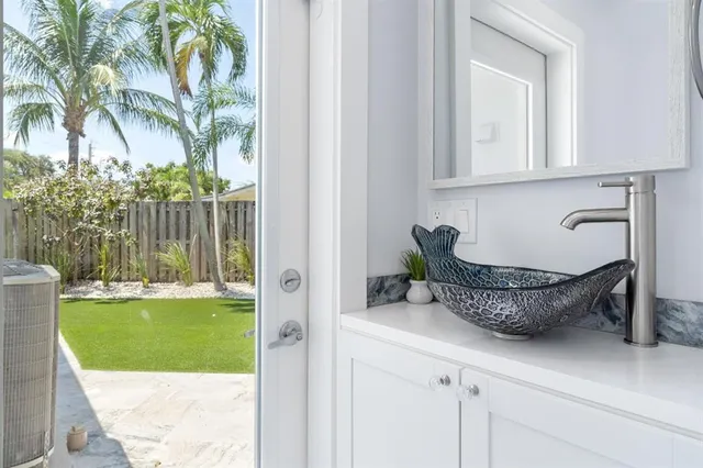 a view of a room with a tub and couches chair