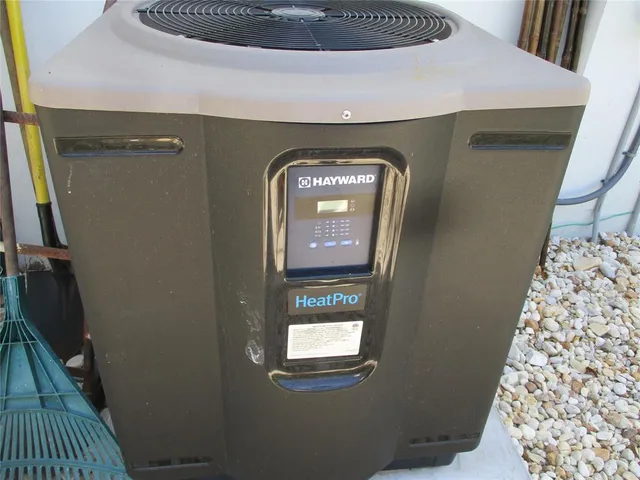 a view of a house with a big yard and potted plants