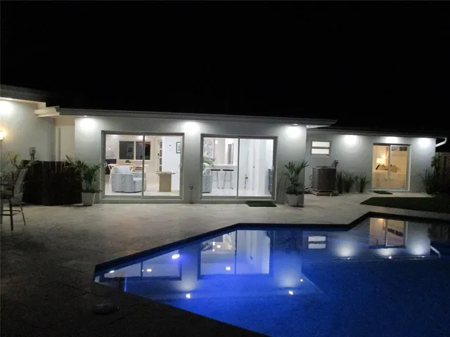 a view of kitchen with dining table and chairs