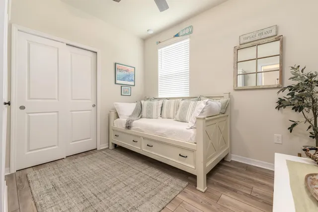 a view of an entryway with wooden floor