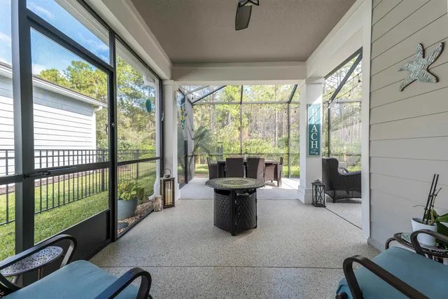 a view of a house with swimming pool and porch with furniture