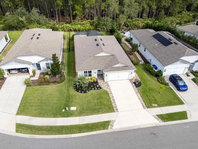 an aerial view of a house with a swimming pool