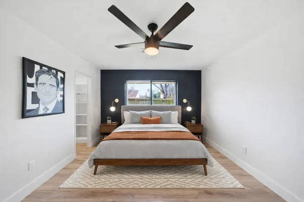 a bed room with a bed and a window