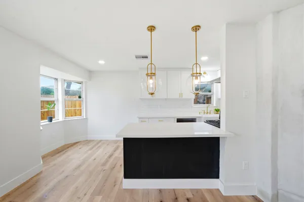 a view of living room with wooden floor