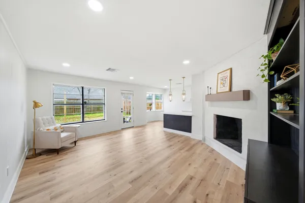a view of livingroom with furniture window and fireplace