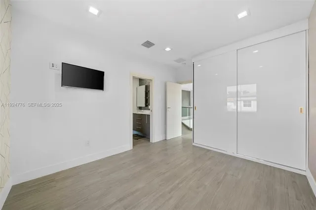 a view of a livingroom with an empty space and a window