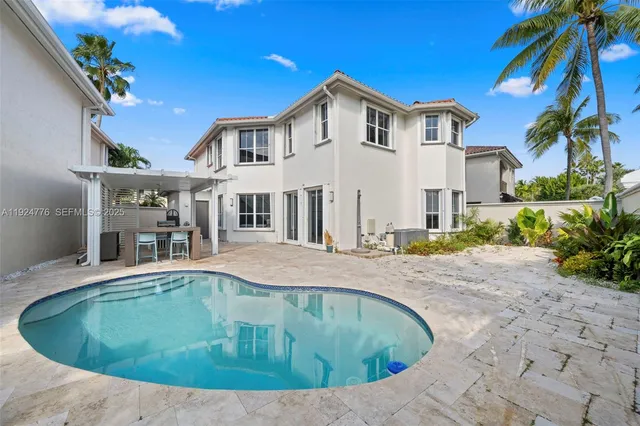 a view of a house with a swimming pool