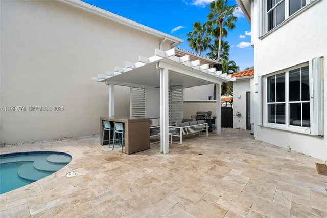 a view of a room with furniture and a potted plant