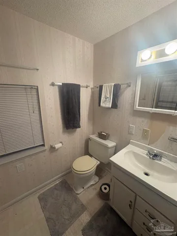 a bathroom with a glass door shower