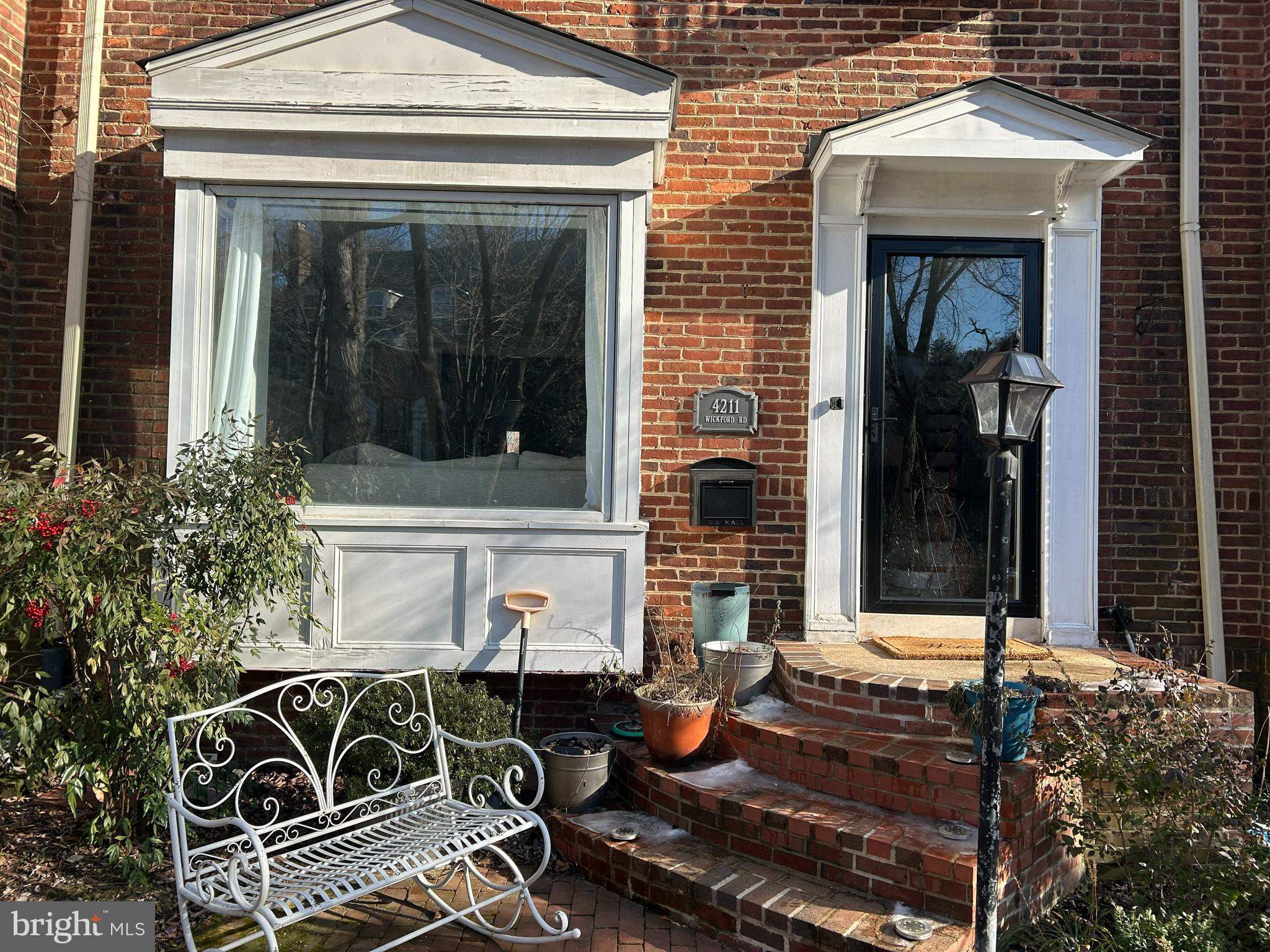 4211 Wickford Road Baltimore, MD 21210 - Photo 1 of 16 an outdoor view of house with outdoor seating