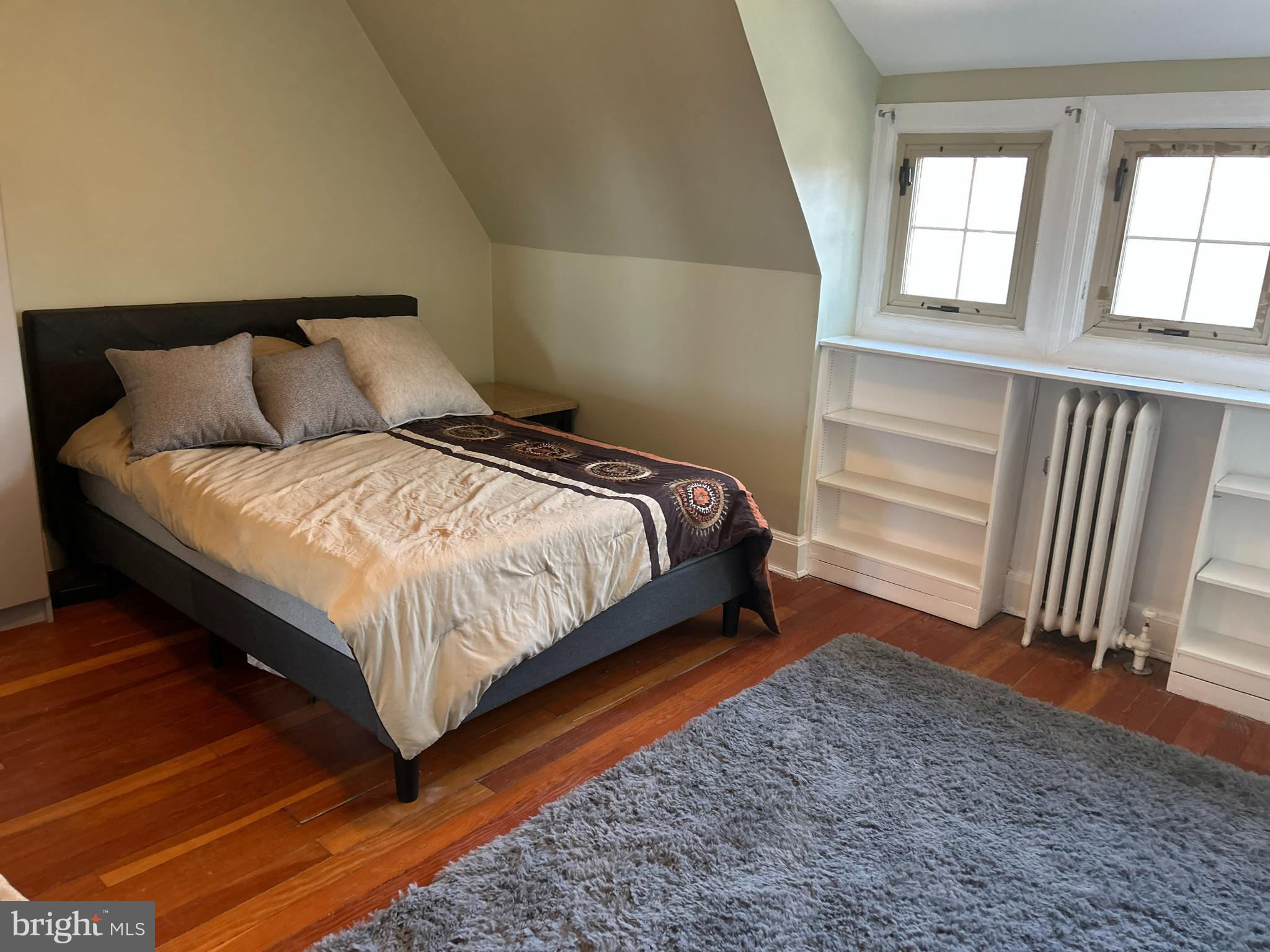 4211 Wickford Road Baltimore, MD 21210 - Photo 11 of 16 a bedroom with a bed and a window
