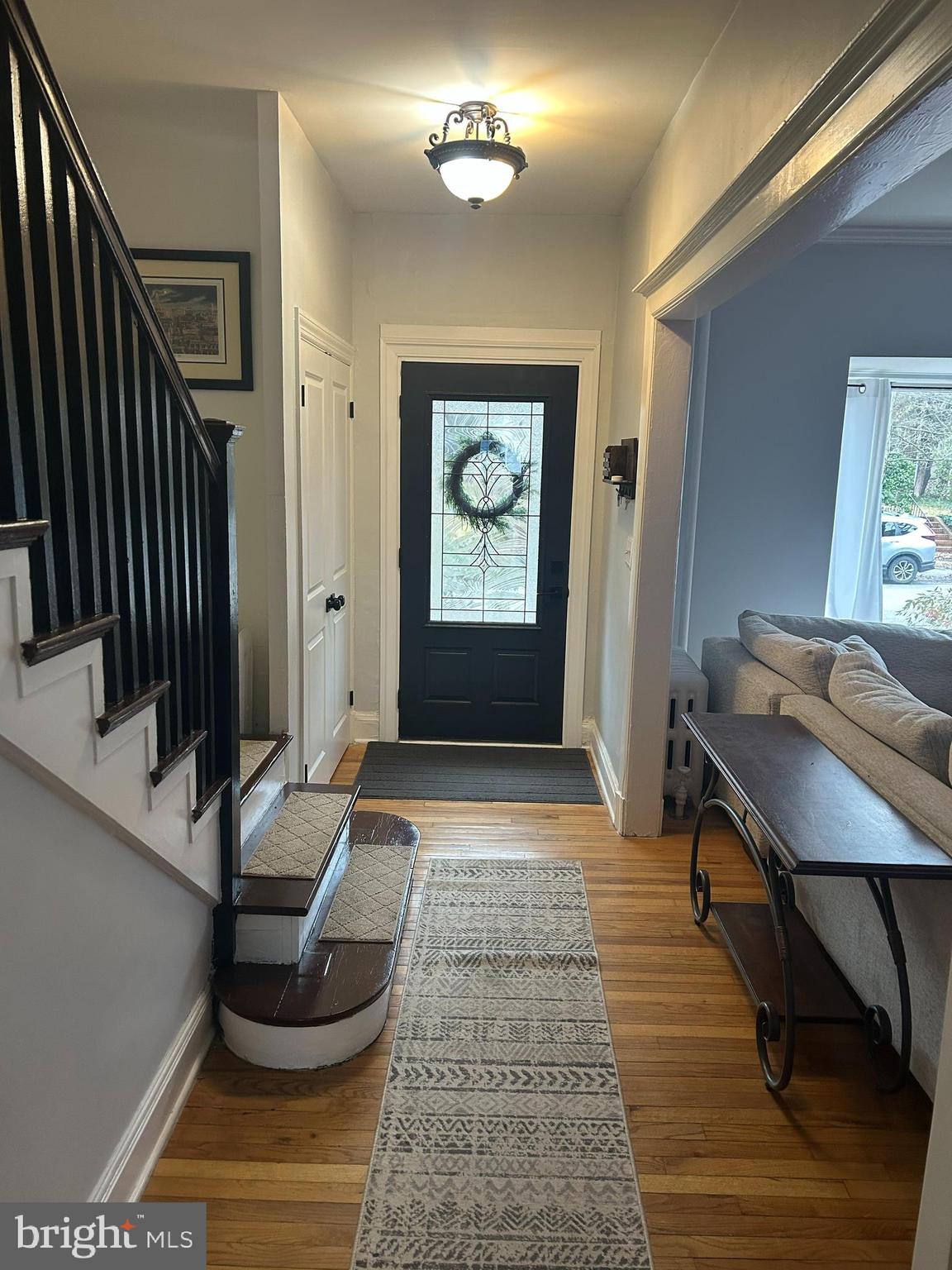 4211 Wickford Road Baltimore, MD 21210 - Photo 2 of 16 a view of a hallway with wooden floor and workspace