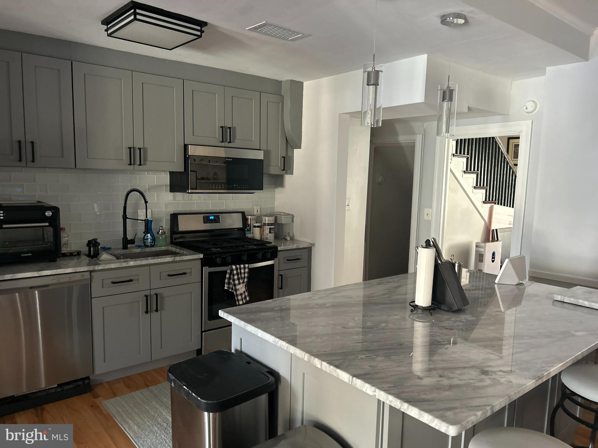 4211 Wickford Road Baltimore, MD 21210 - Photo 4 of 16 a kitchen with stainless steel appliances granite countertop a sink a stove and refrigerator