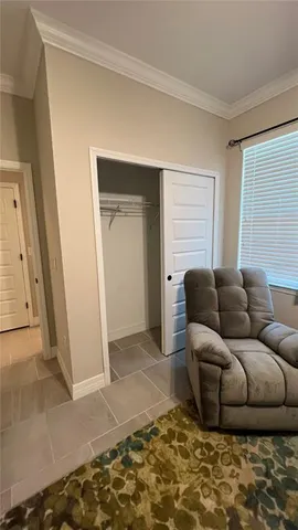 a living room with furniture and a rug