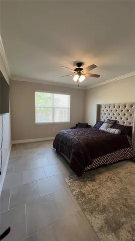 a bedroom with a bed and window