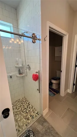 a bathroom with a shower and a sink