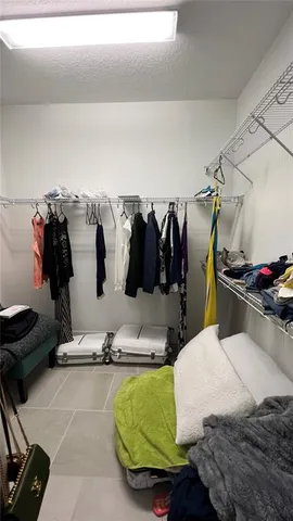 a bedroom with a bed and gym equipment