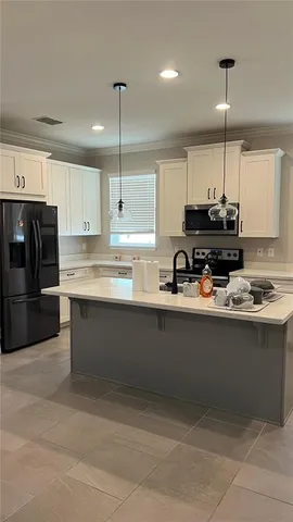 a view of a house with a backyard and a tree