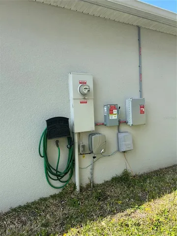 a living room with couch and wall painting