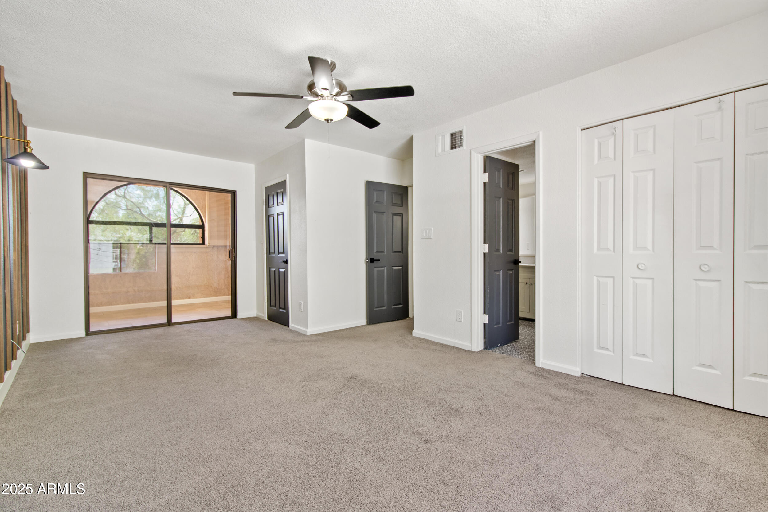 2500 North Hayden Road, Unit 15 Scottsdale, AZ 85257 - Photo 17 of 34 an empty room with windows and entryway