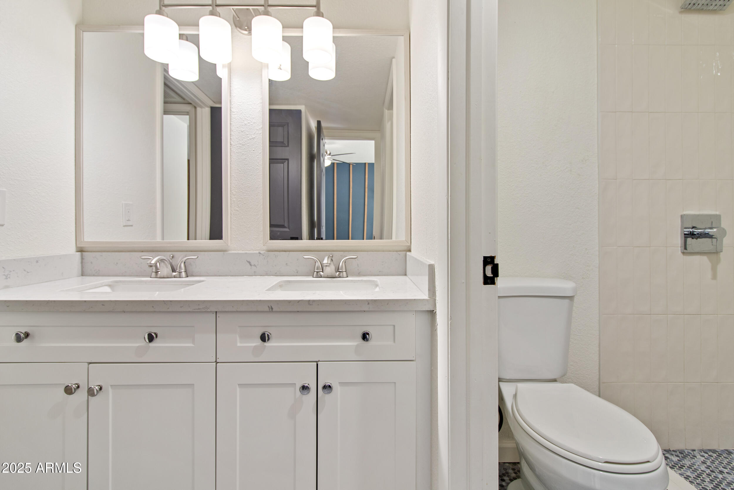 2500 North Hayden Road, Unit 15 Scottsdale, AZ 85257 - Photo 19 of 34 a bathroom with a toilet a sink and mirror