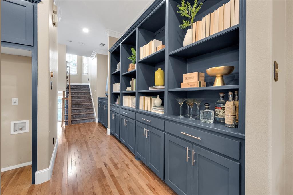 5102 Ridgedale Avenue Dallas, TX 75206 - Photo 13 of 27 Custom built-in shelving with lower cabinetry and brushed nickel hardware