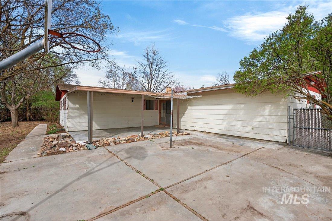 10035 W Lane Boise, ID 83709 - Photo 26 of 32 Rear view of house with a gate and a patio area