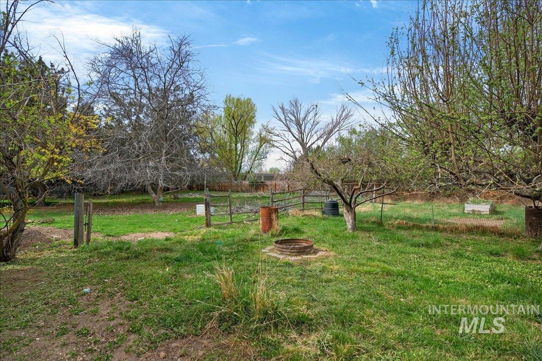 10035 W Lane Boise, ID 83709 - Photo 29 of 32 View of yard with an outdoor fire pit