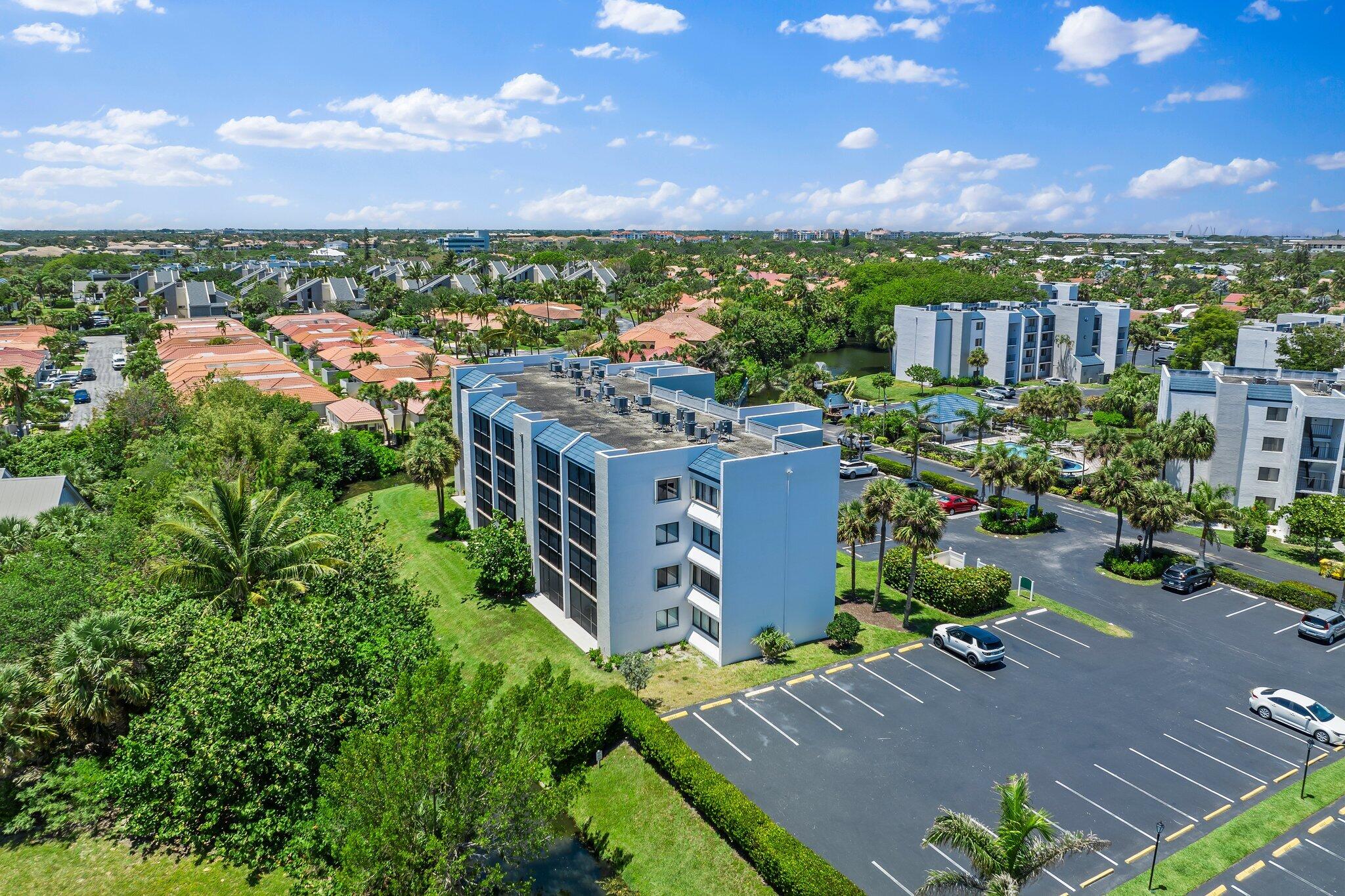 1605 South U Highway, Unit F 106 Jupiter, FL 33477 - Photo 12 of 43 a view of a city and a yard