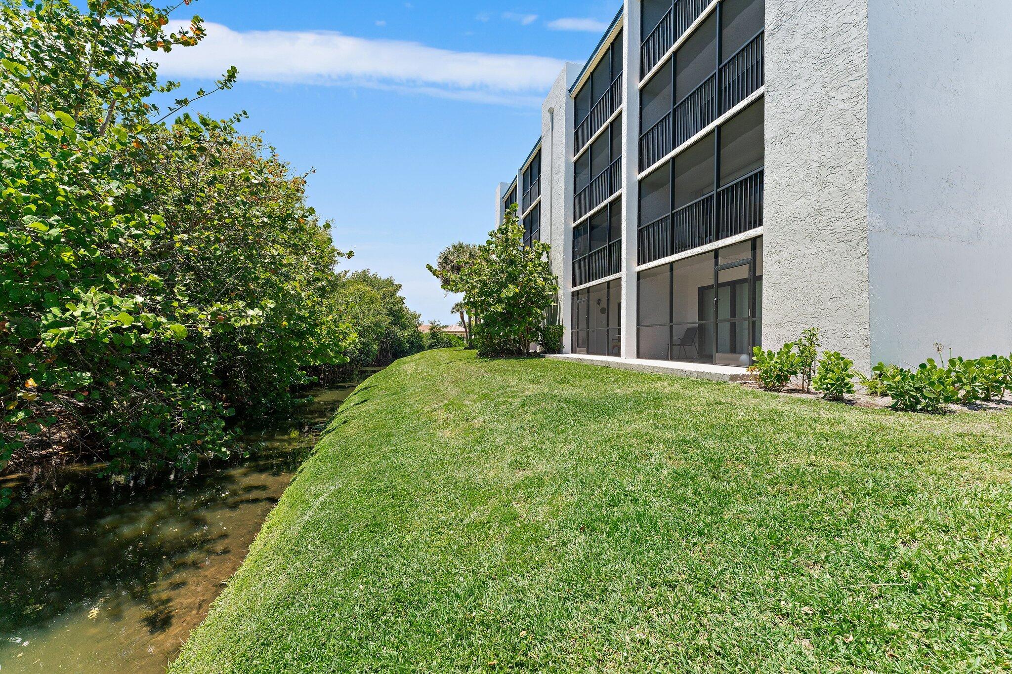 1605 South U Highway, Unit F 106 Jupiter, FL 33477 - Photo 13 of 43 a view of an apartment with a yard
