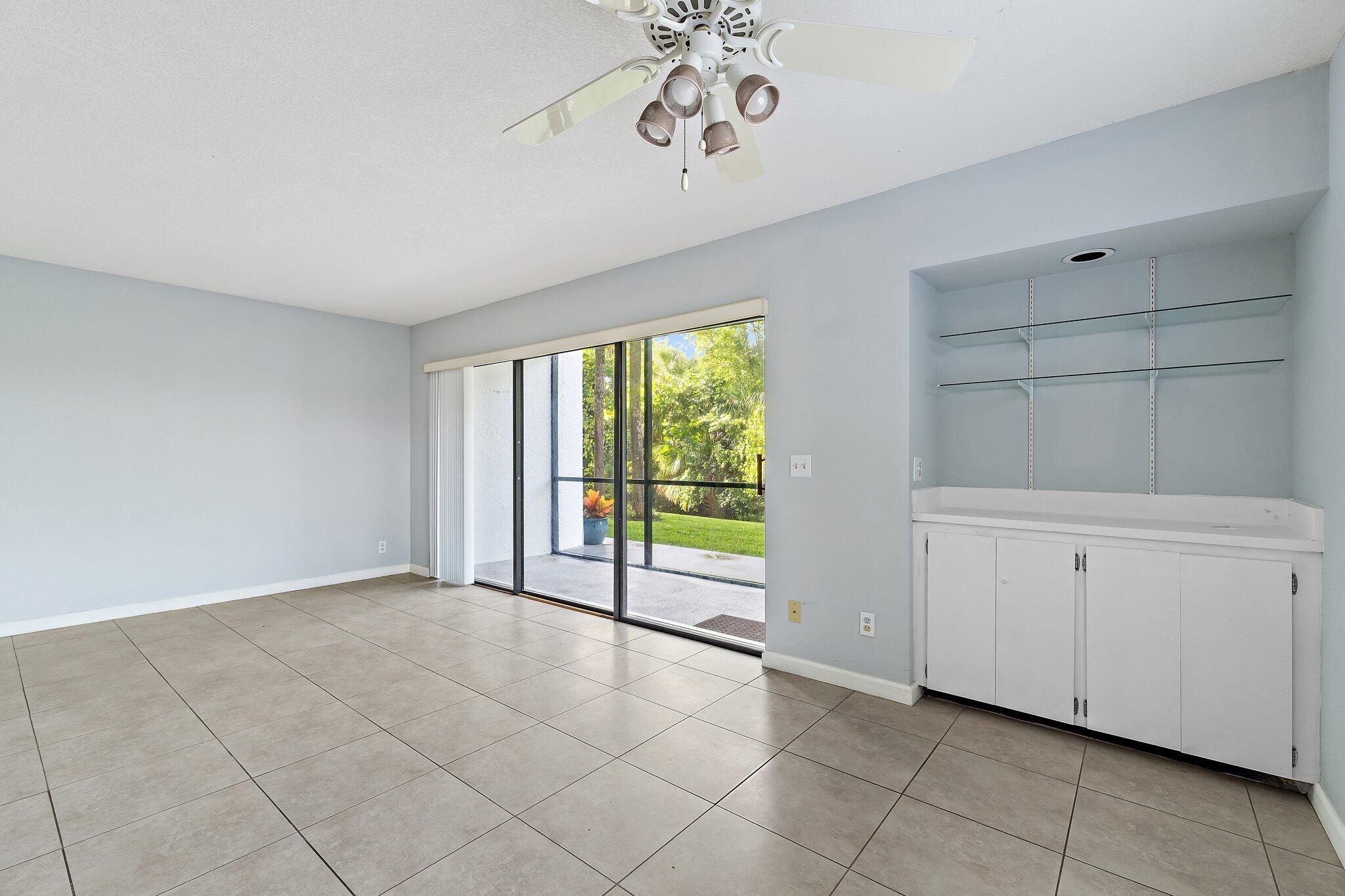 1605 South U Highway, Unit F 106 Jupiter, FL 33477 - Photo 26 of 43 a view of an empty room with a window
