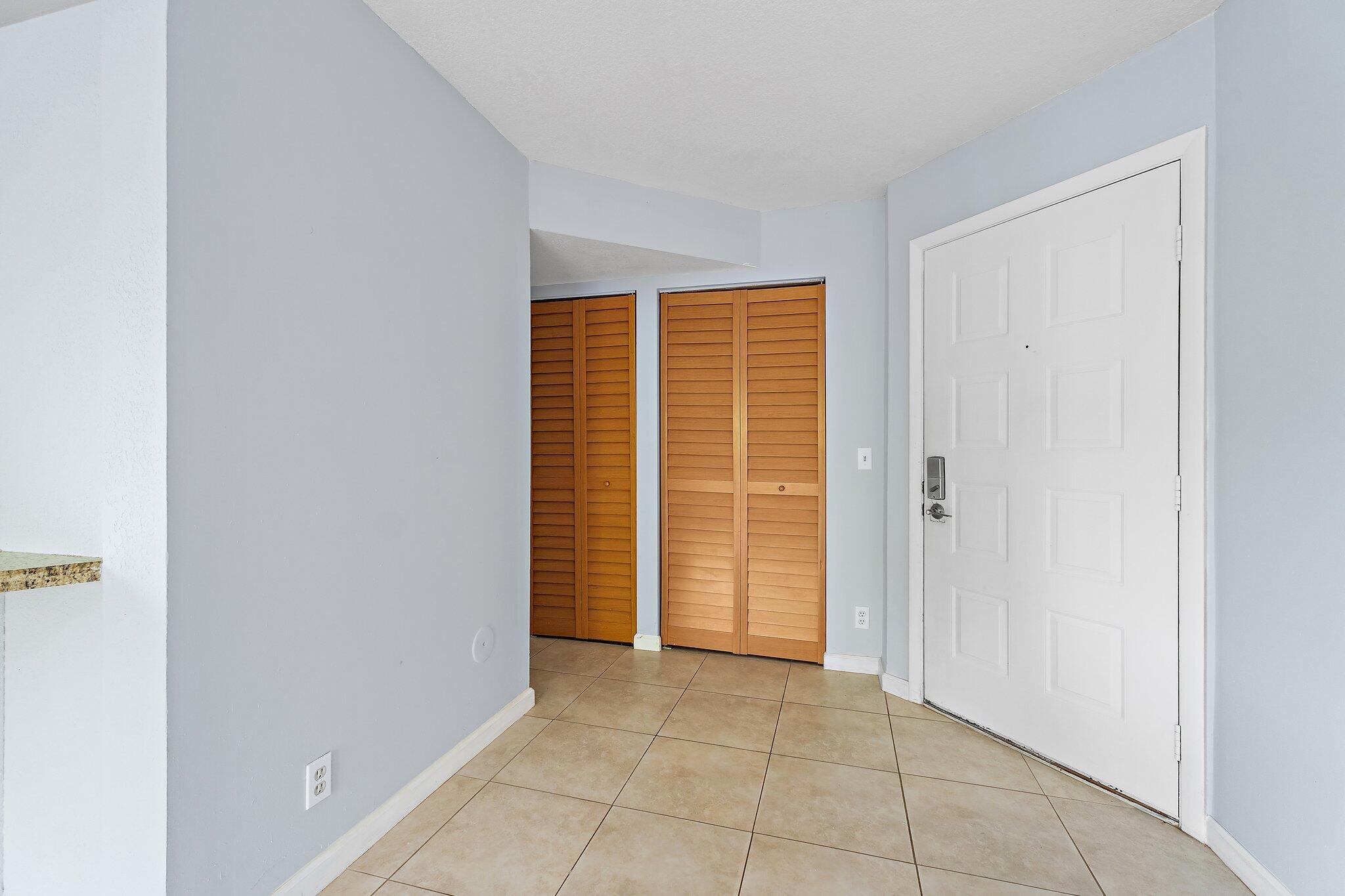 1605 South U Highway, Unit F 106 Jupiter, FL 33477 - Photo 27 of 43 a view of an empty room with closet area