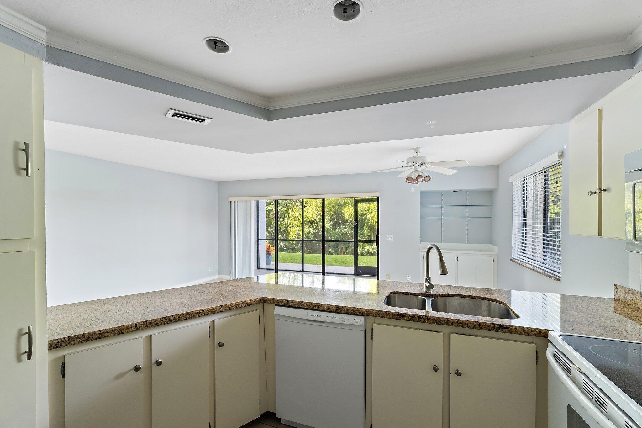 1605 South U Highway, Unit F 106 Jupiter, FL 33477 - Photo 32 of 43 a kitchen with a sink and window