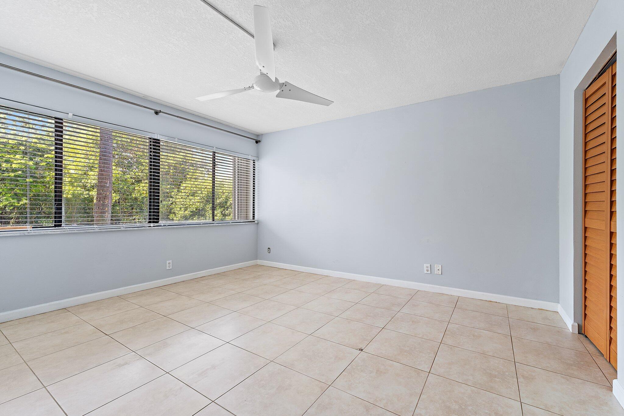 1605 South U Highway, Unit F 106 Jupiter, FL 33477 - Photo 35 of 43 a view of an empty room with a window