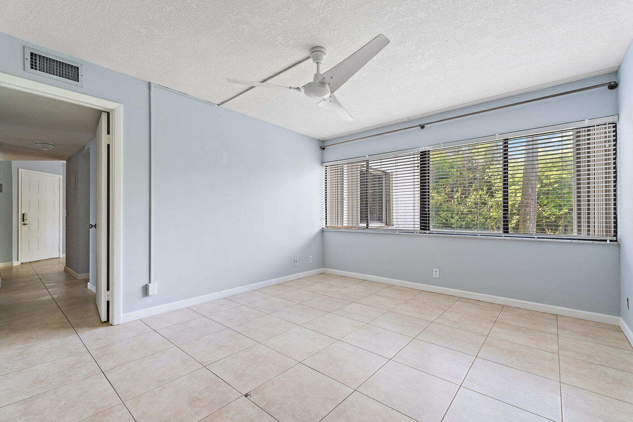 1605 South U Highway, Unit F 106 Jupiter, FL 33477 - Photo 36 of 43 a view of an empty room with a window