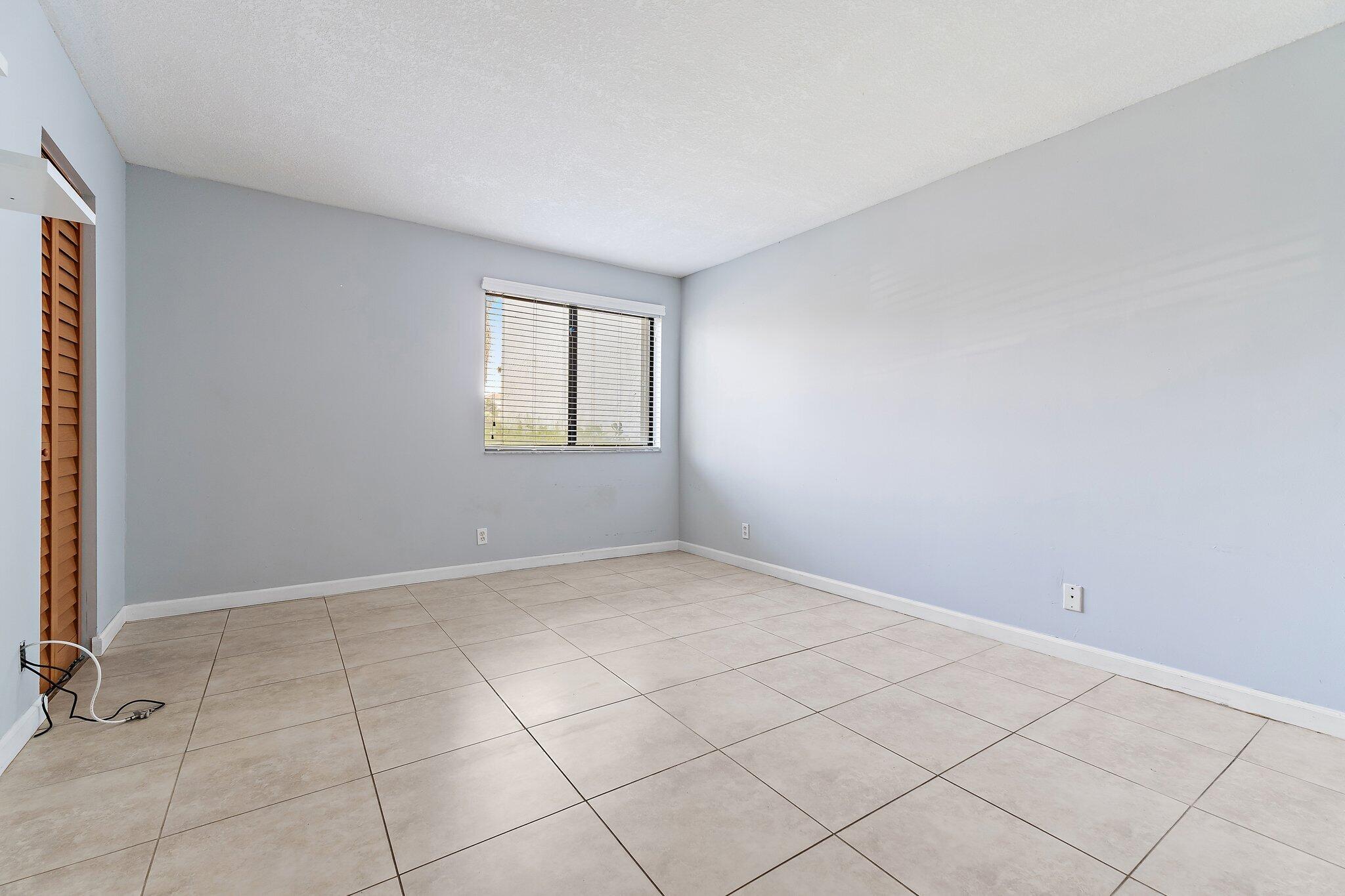 1605 South U Highway, Unit F 106 Jupiter, FL 33477 - Photo 40 of 43 an empty room with windows