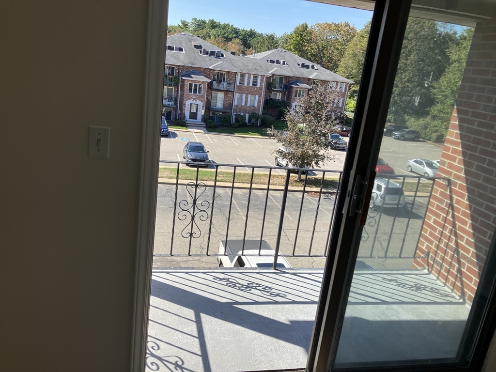 360 Neponset Street, Unit 605 Canton, MA 02021 - Photo 11 of 21 a view of balcony with a floor to ceiling window with wooden floor