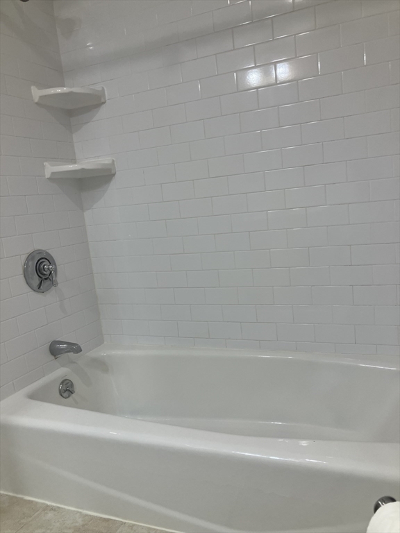 360 Neponset Street, Unit 605 Canton, MA 02021 - Photo 16 of 21 a bathroom with a shower and a bathtub