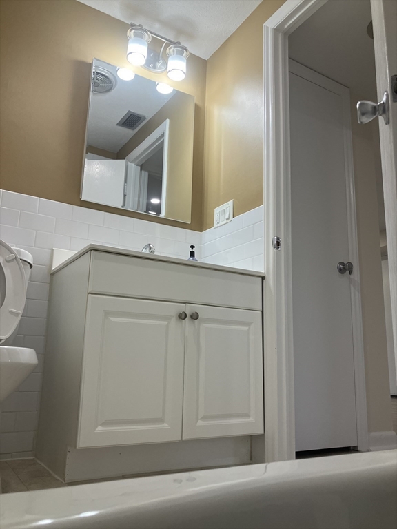 360 Neponset Street, Unit 605 Canton, MA 02021 - Photo 17 of 21 a bathroom with a sink and a mirror