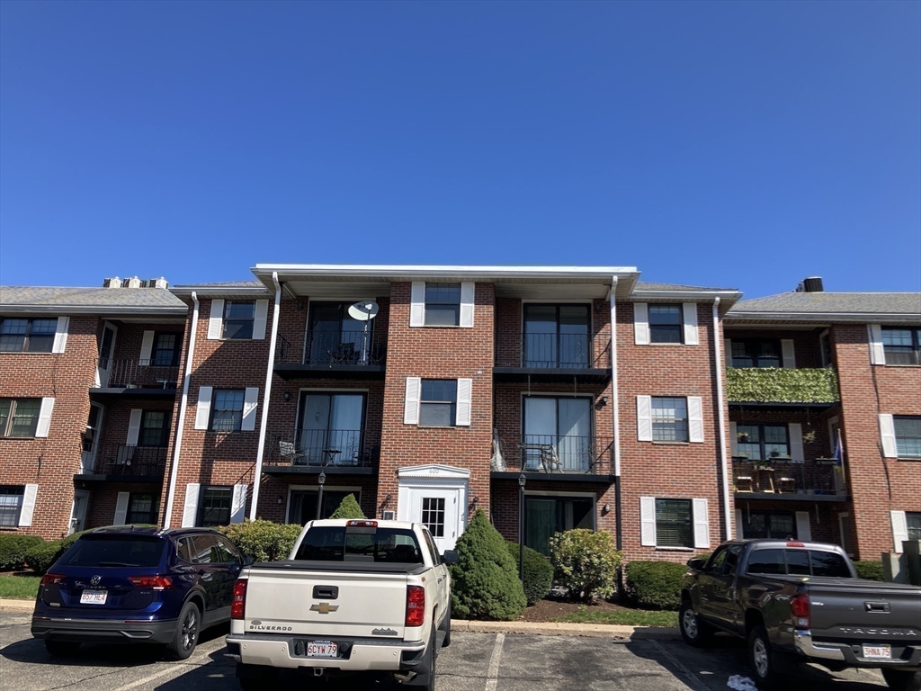 360 Neponset Street, Unit 605 Canton, MA 02021 - Photo 18 of 21 a car parked in front of a building
