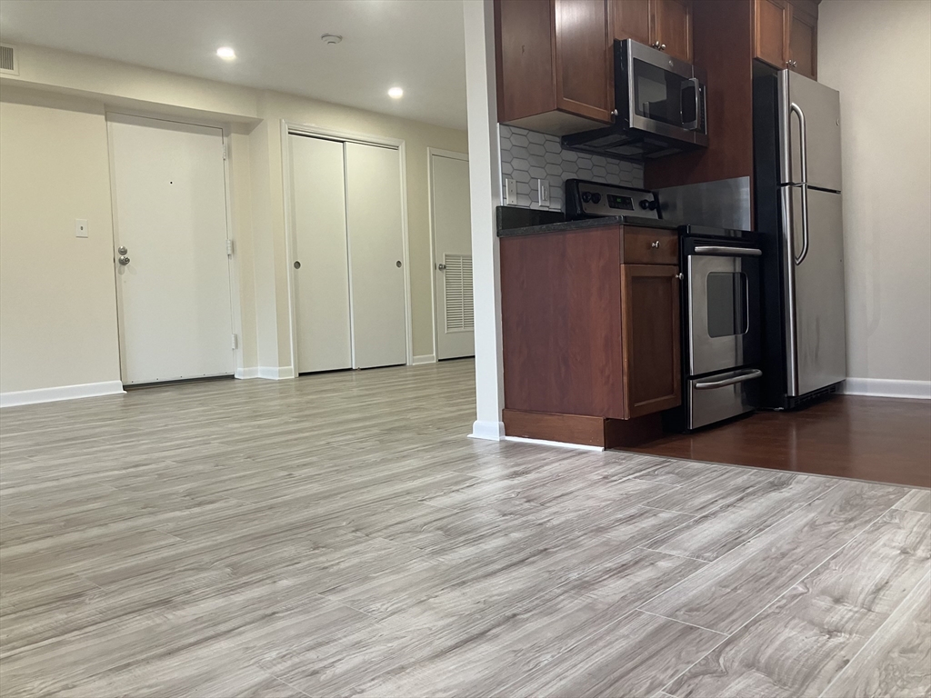360 Neponset Street, Unit 605 Canton, MA 02021 - Photo 2 of 21 a view of kitchen with stainless steel appliances granite countertop a refrigerator and a stove top oven