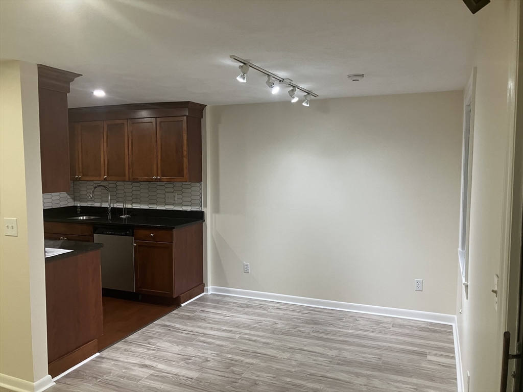 360 Neponset Street, Unit 605 Canton, MA 02021 - Photo 5 of 21 a view of kitchen with granite countertop cabinets and refrigerator