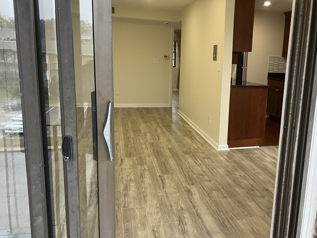360 Neponset Street, Unit 605 Canton, MA 02021 - Photo 10 of 21 a view of hallway with wooden floor