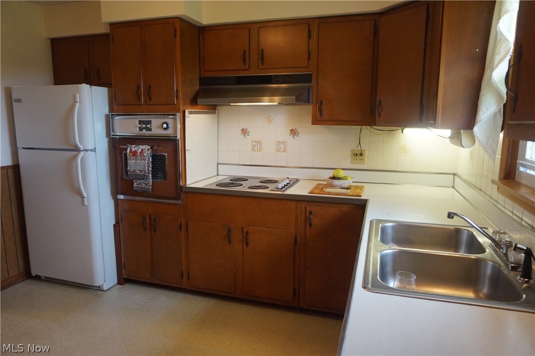 2465 South Ridge Road East Ashtabula, OH 44004 - Photo 5 of 38 Vintage Kitchen, range hood, built in oven, hand crafted cabinets.