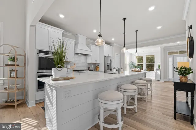 a kitchen with stainless steel appliances granite countertop a sink and cabinets
