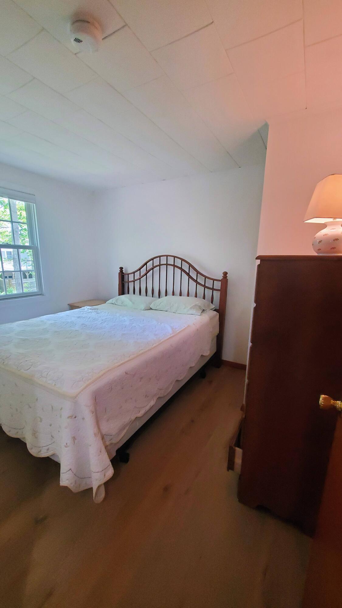 66 Uncle Edwards Road Mashpee, MA 02649 - Photo 11 of 18 a bedroom with a bed and a window