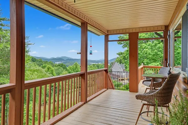 a view of a chairs on the roof deck
