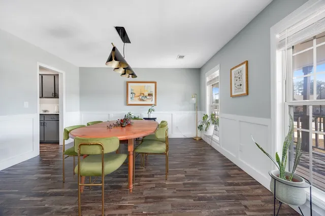 a kitchen with stainless steel appliances a sink stove and wooden cabinets