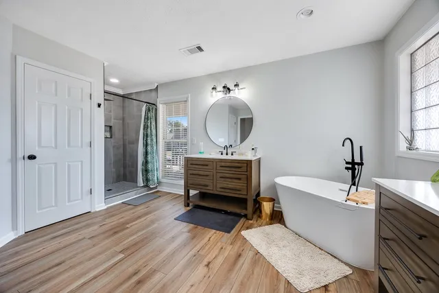 a view of a livingroom with workspace and a window